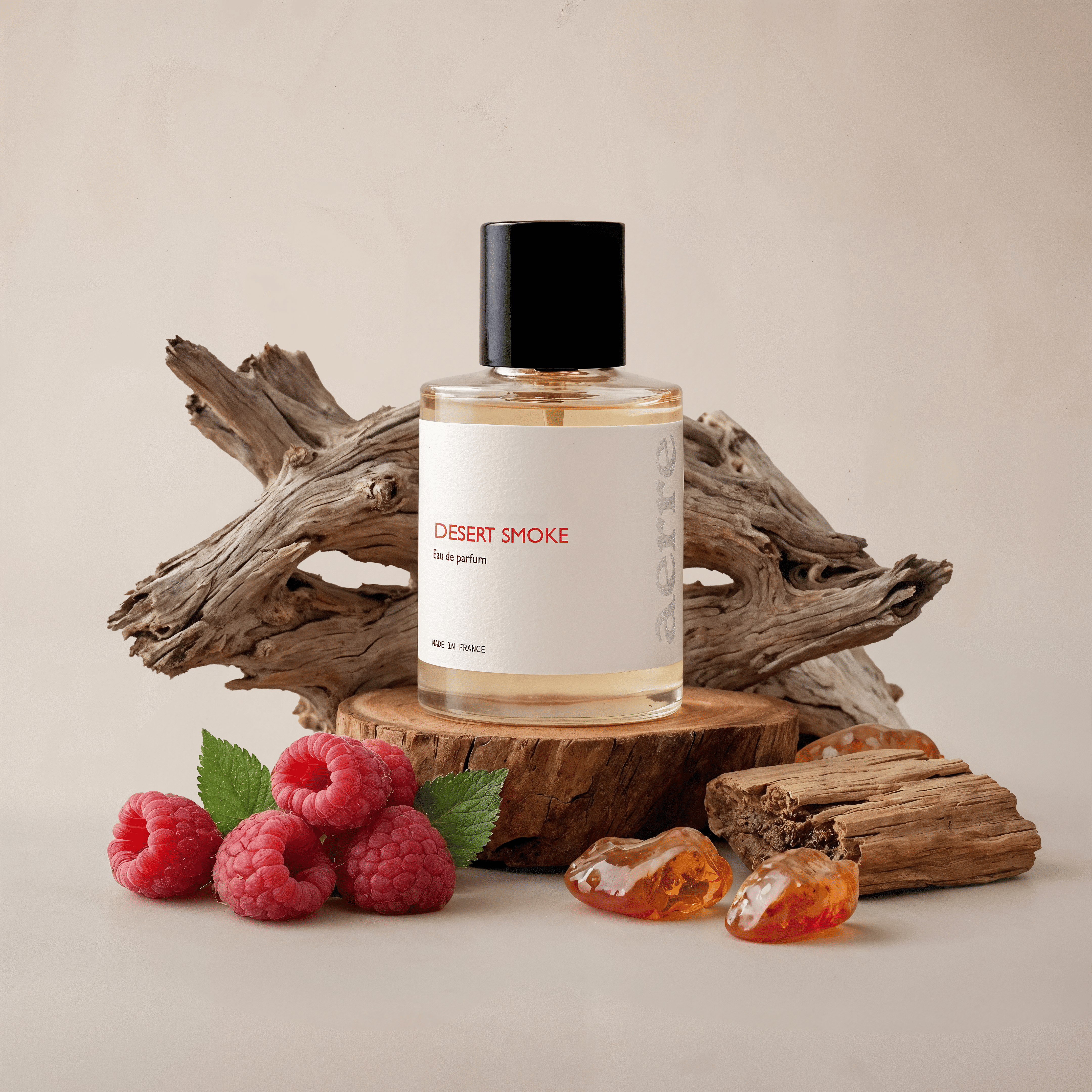 Desert Smoke perfume bottle on a wooden platform with raspberries and dried fruits on a beige background