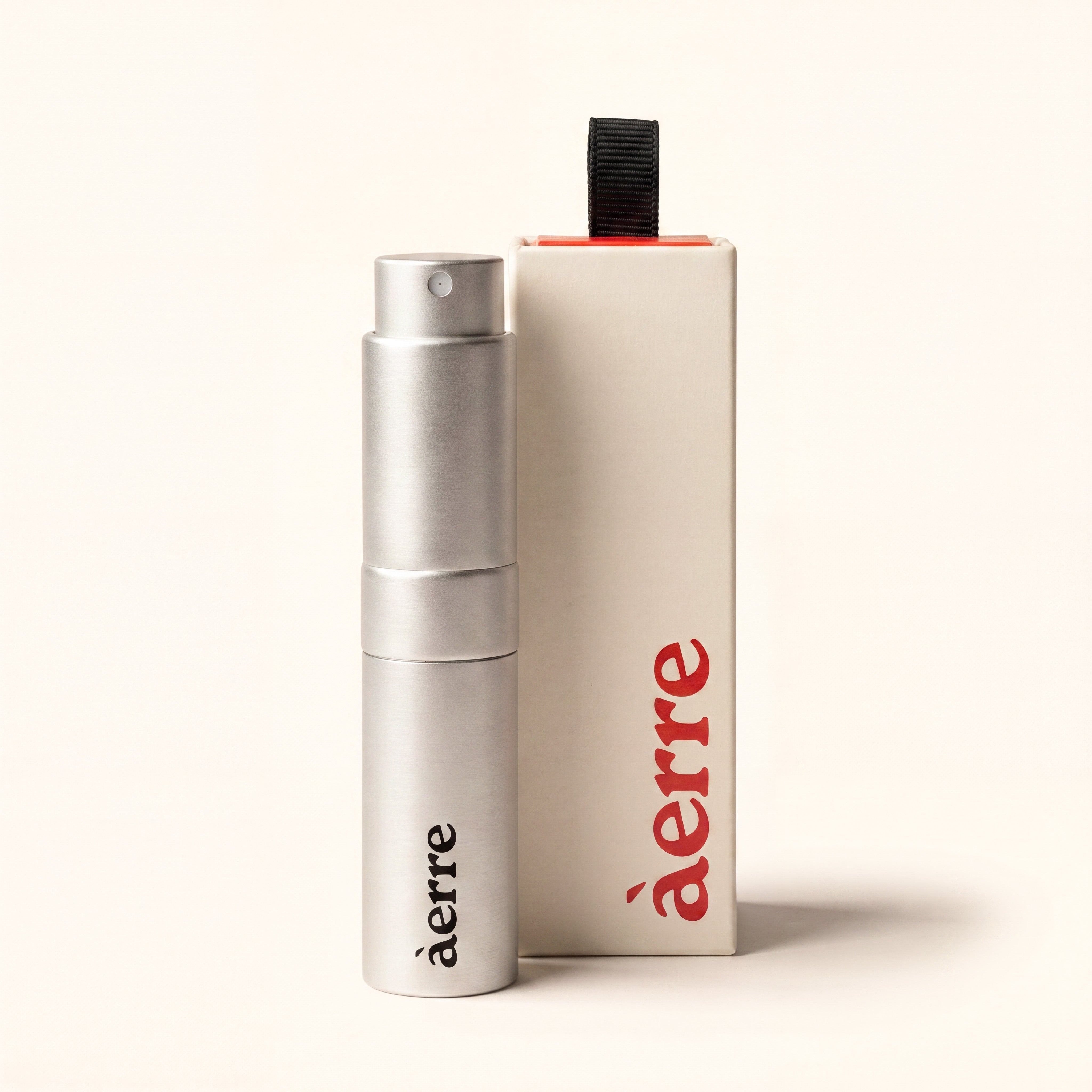 Silver Aerre perfume atomiser and packaging on a white background