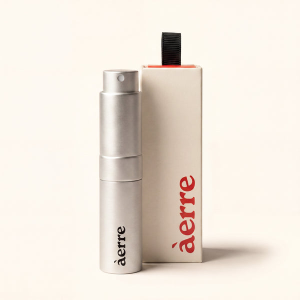 Silver Aerre perfume atomiser and packaging on a white background